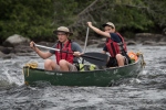 Learning to paddle a canoe in moving water